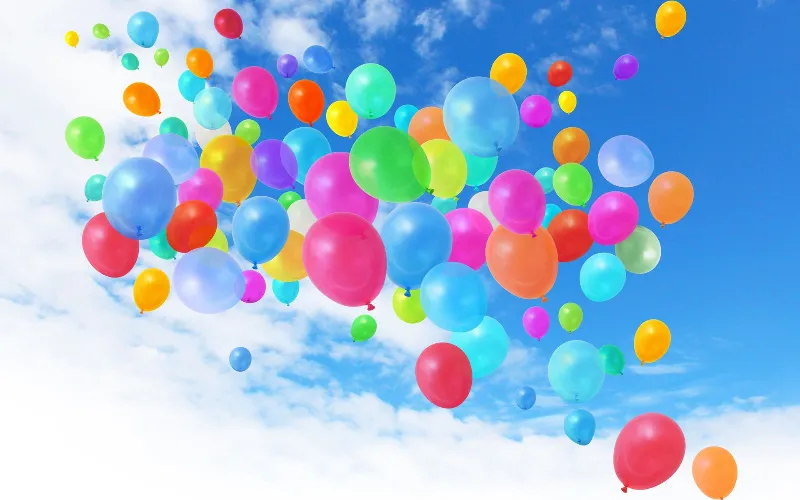 Something Beautiful Remains colourful balloon release celebrating a loved one's life during a memorial service.